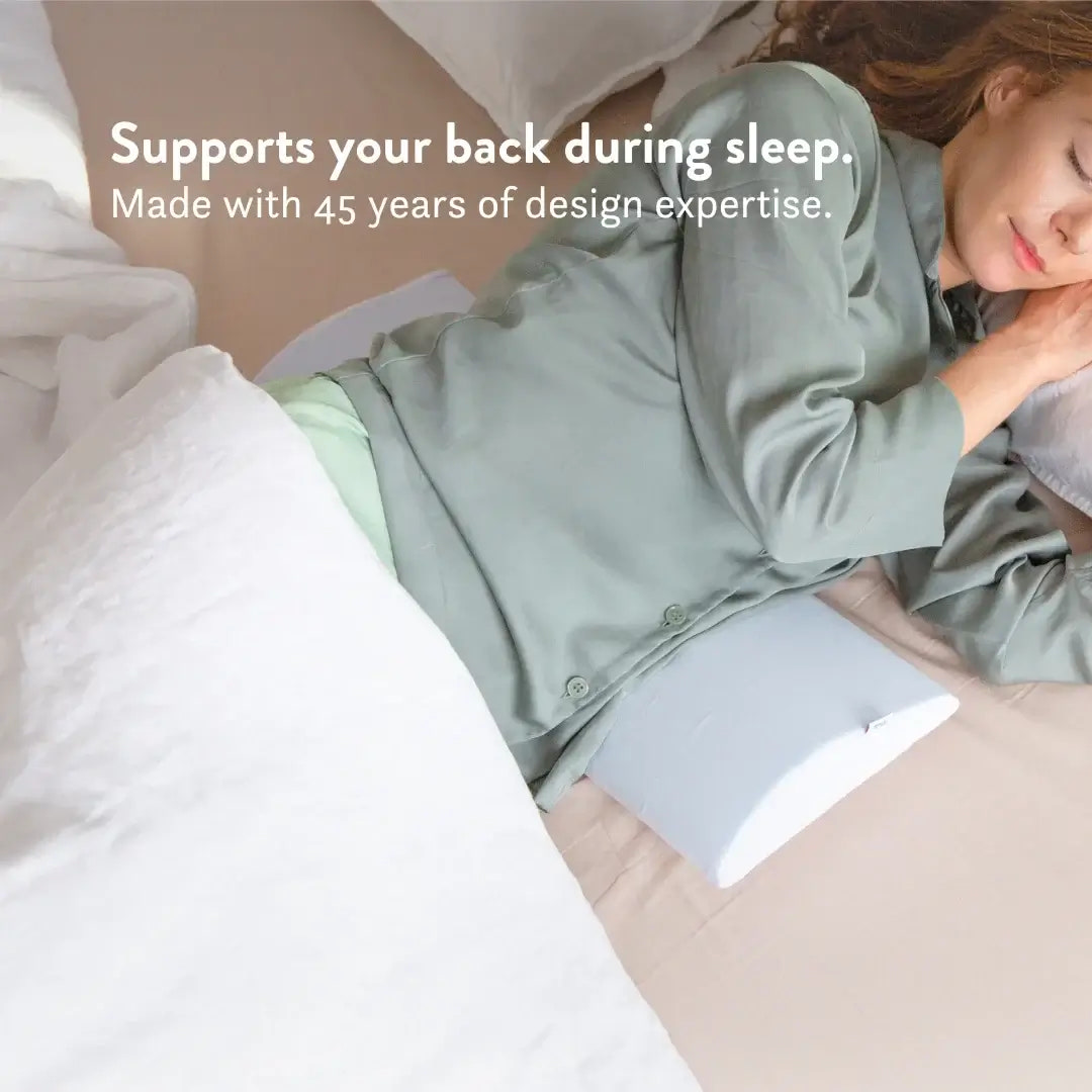 Person lying in bed with a pillow and blanket, text about sleep support and design expertise.