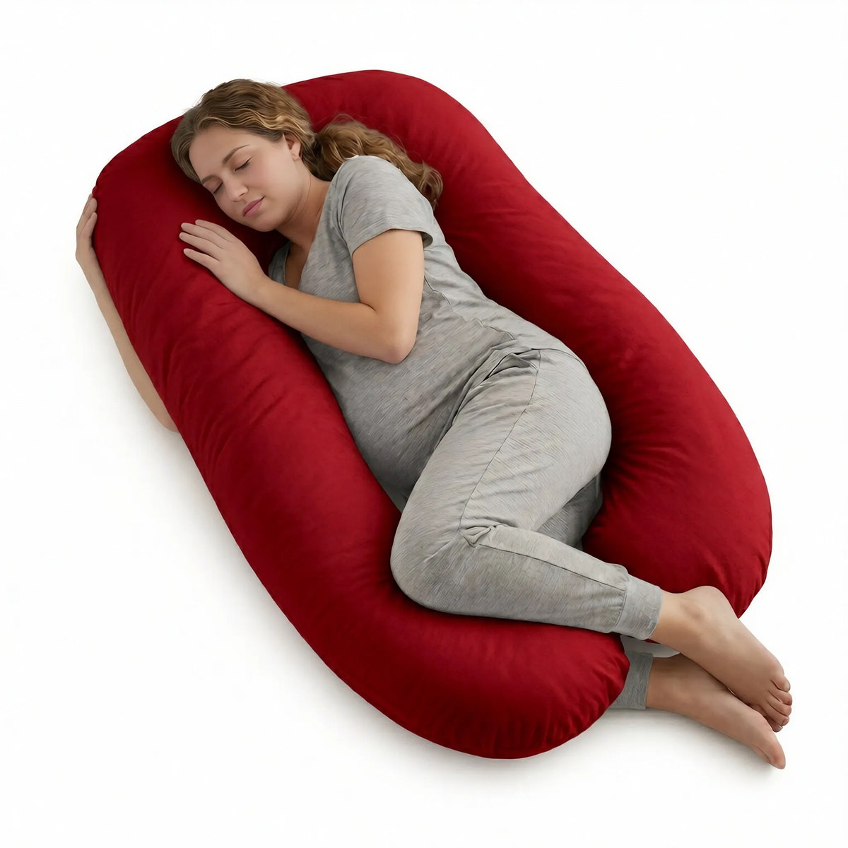 Woman lying on a red body pillow on a white background
