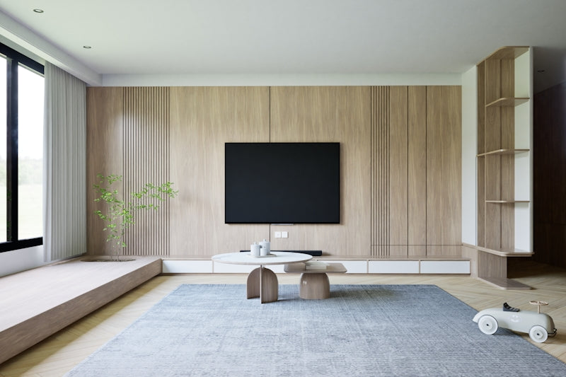 a living room with a television and a large window