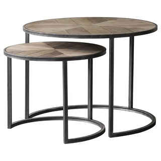 Nesting round tables with patterned wood tops and metal frames.