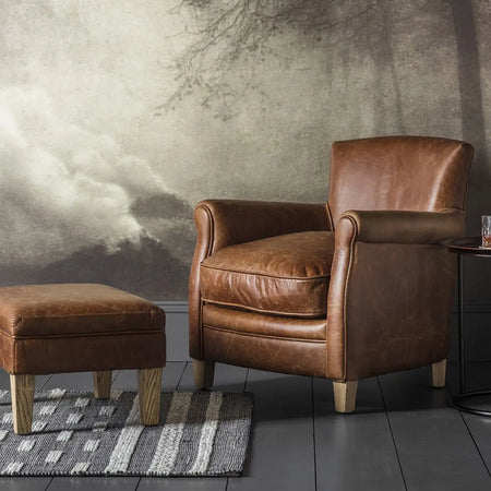 Brown leather armchair and ottoman.