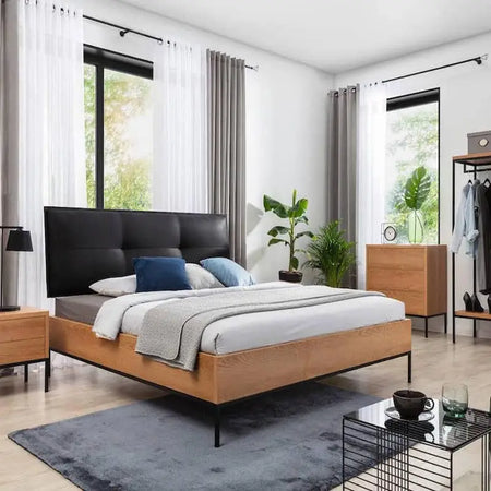 Modern bedroom with wooden bed frame.