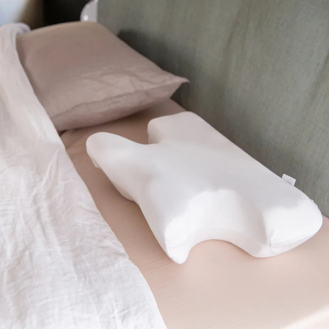 Contoured CPAP Pillow with C-Shaped Cut-Outs for Mask Users