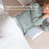 Person lying in bed with a pillow and blanket, text about sleep support and design expertise.