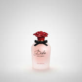 Dolce Vita Dolce Dolce & Gabbana perfume bottle in pale pink glass with a red rose-shaped cap and a black ribbon bow, on a white background.