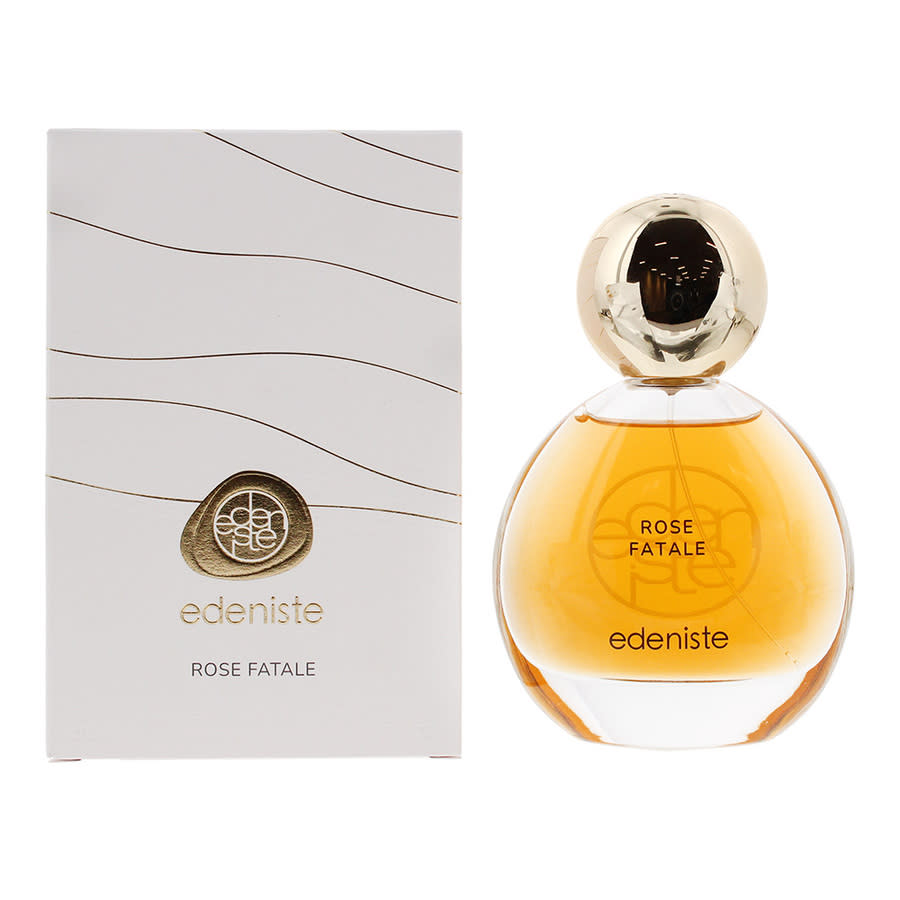 Edeniste Rose Fatale perfume bottle with amber liquid and a gold cap next to its white packaging box with gold wavy lines and a gold logo.