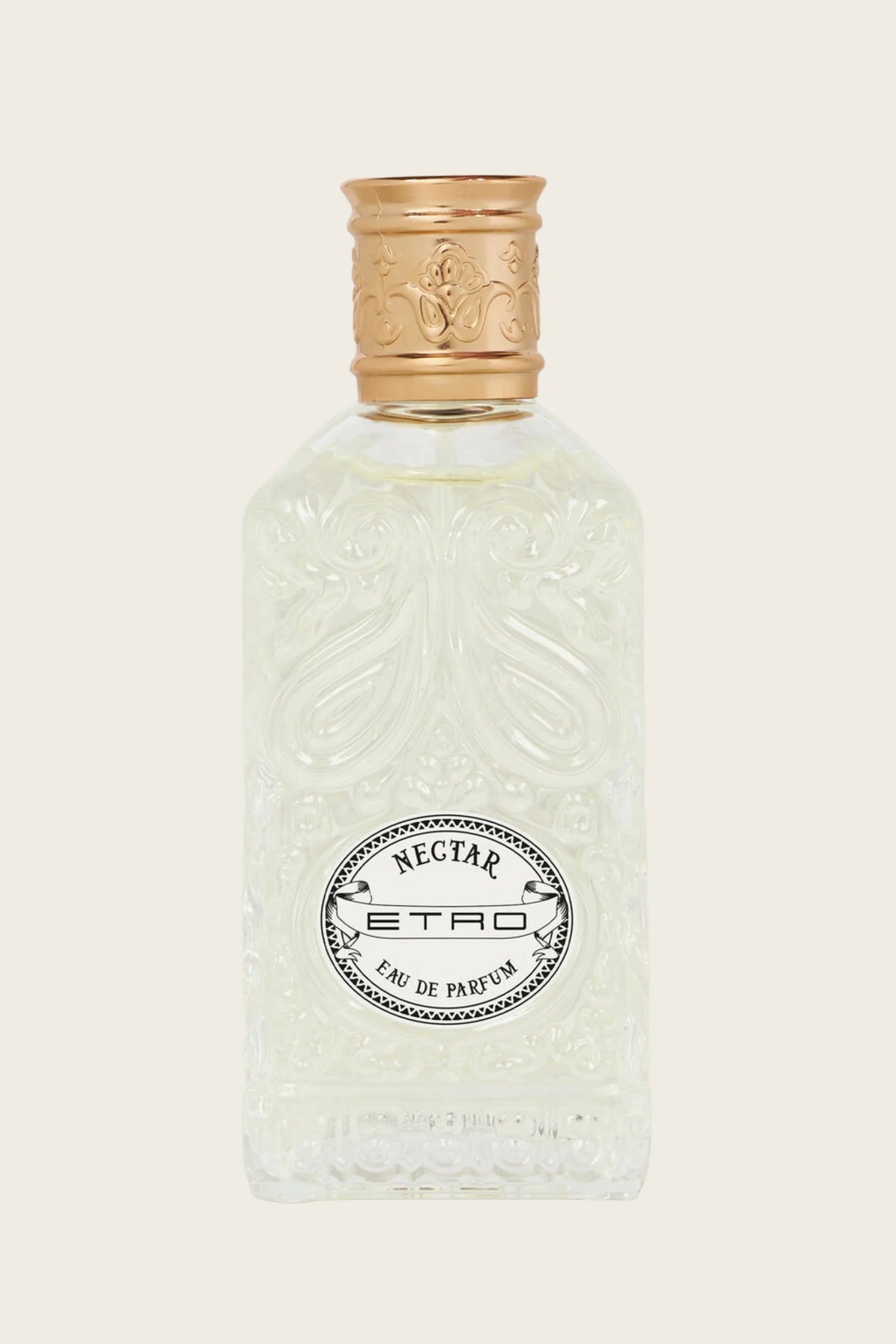 A clear glass perfume bottle with embossed floral detailing, featuring a gold-toned cap and a circular black-and-white label that reads 'NECTAR ETRO EAU DE PARFUM'.