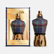 Jean Paul Gaultier perfume bottle with plaid design and gold accents on a white background