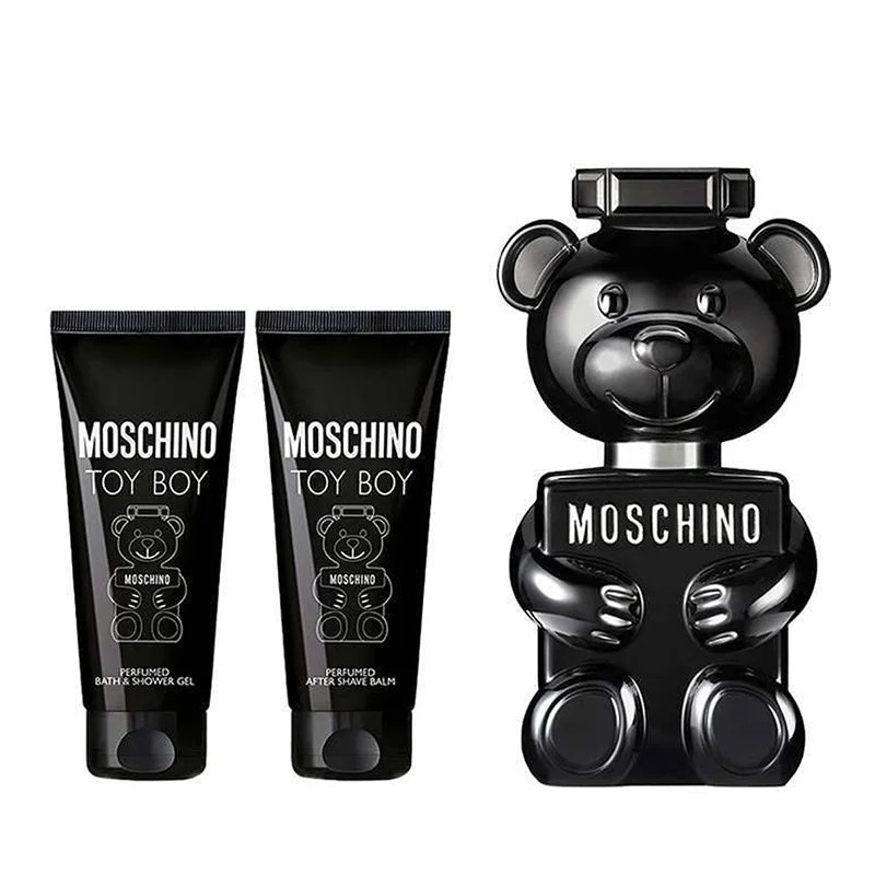 Moschino Toy Boy fragrance gift set featuring a large glossy black bear-shaped bottle and two matching black tubes of bath and shower gel, all with white text on a plain white background.