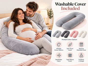 Pregnant couple cuddling on a bed while wearing a large U-shaped body pillow, with a product information panel on the right showing the washable cover included in multiple colors.