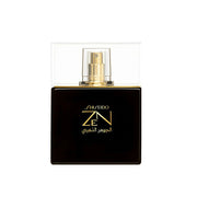 Shiseido ZN perfume bottle in a glossy black rectangular design with gold lettering and a gold spray nozzle under a clear protective cover, set against a plain white background.